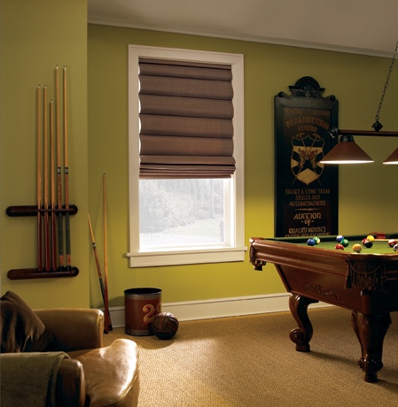 Roman shades in Bluff City pool room with green walls.